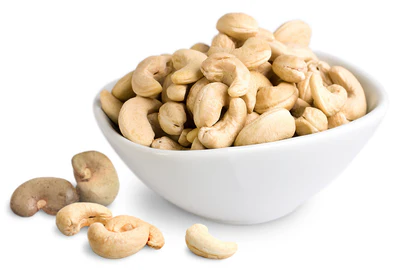 Raw organic whole cashews in a bowl